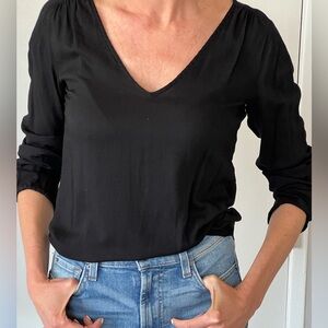 Basic black 3/4 sleeve top. Very versatile - Can be dressed up or down..